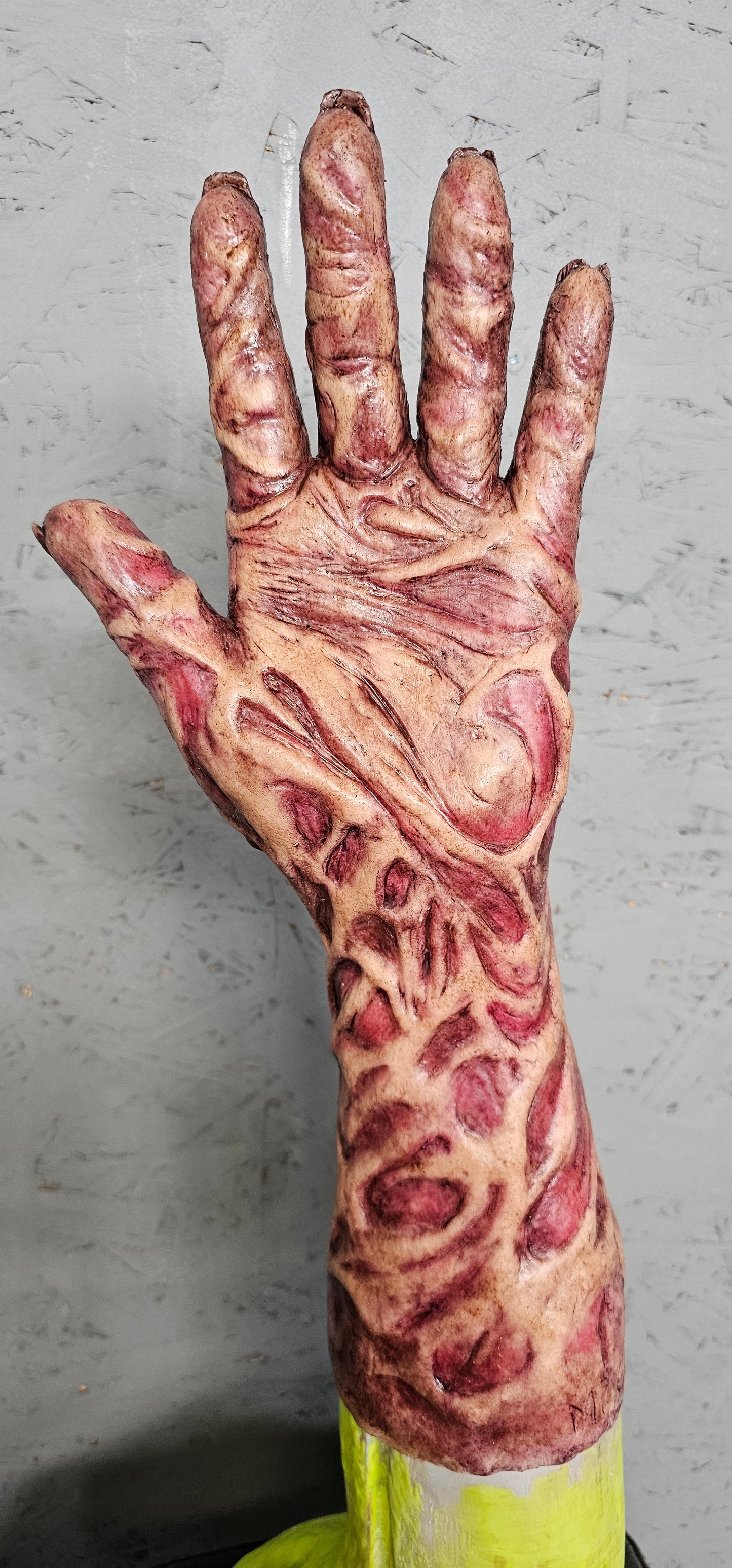 Freddy Burnie silicone sleeve worn on hand — side angle