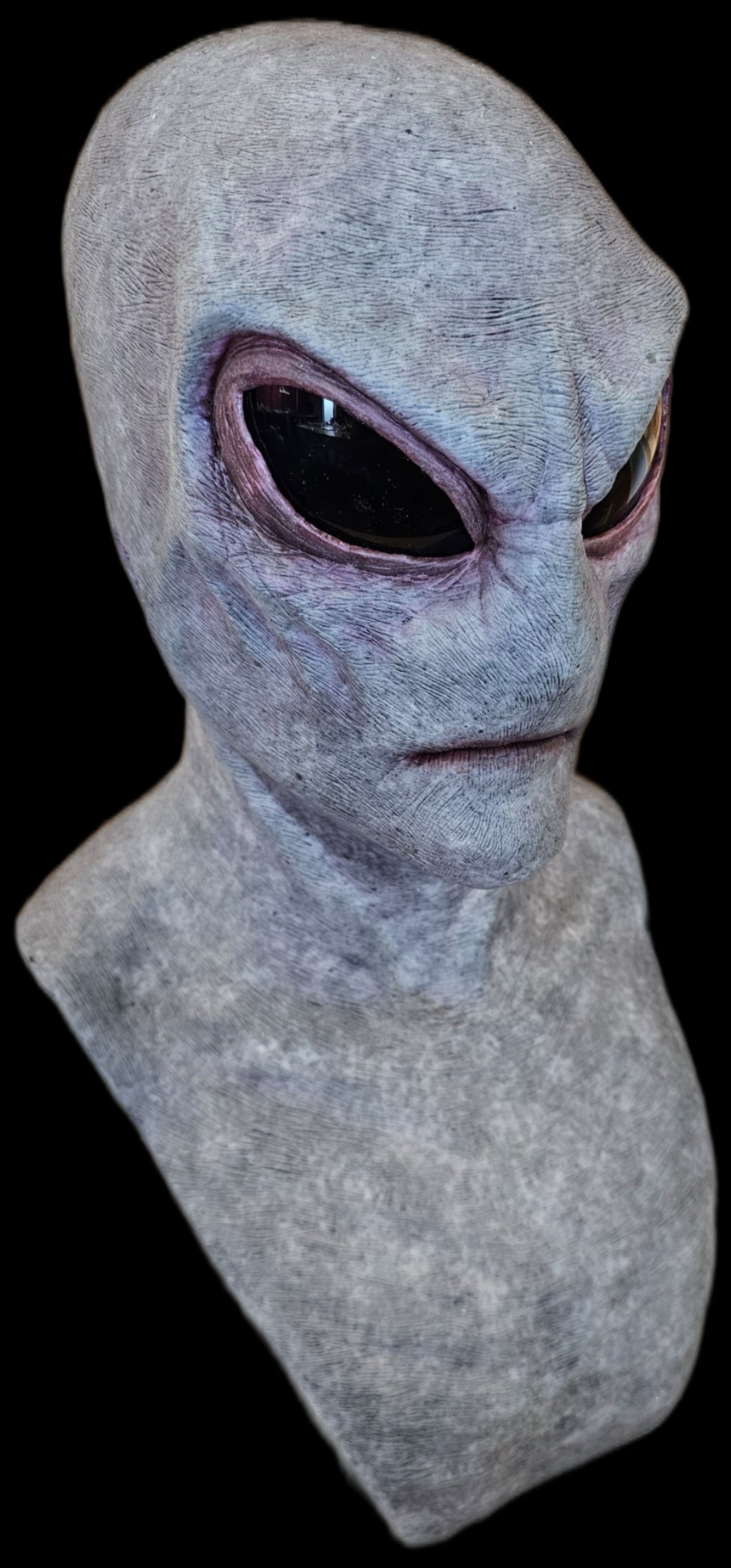 Gray alien head sculptured mask