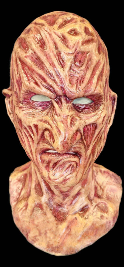 Burnie burnt silicone mask worn — three-quarter left angle