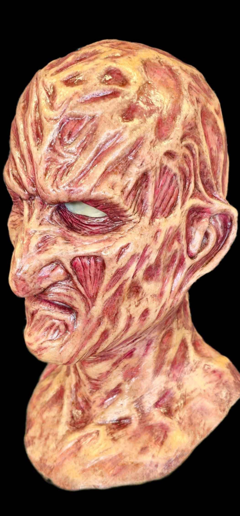 Burnie silicone mask — close-up burnt skin texture detail