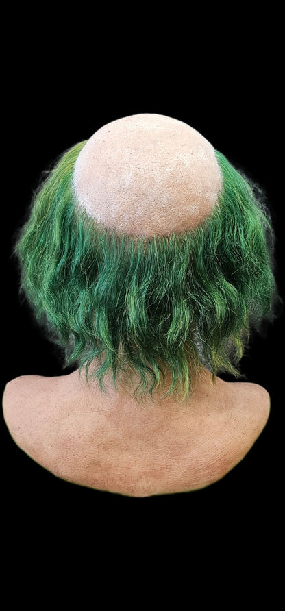 Green hair on a realistic silicone old man mask