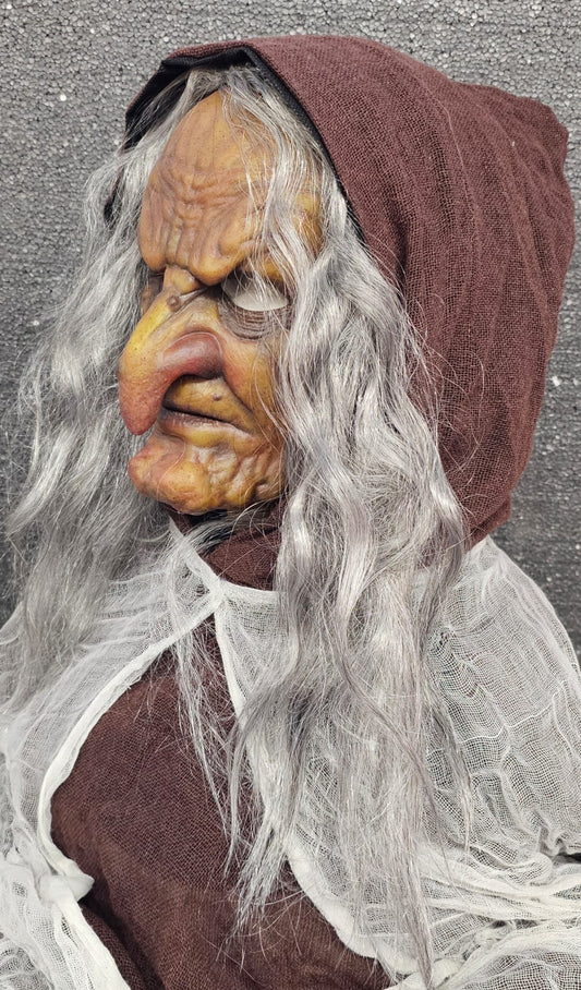 Close-up of witch silicone mask — detailed wrinkled skin texture