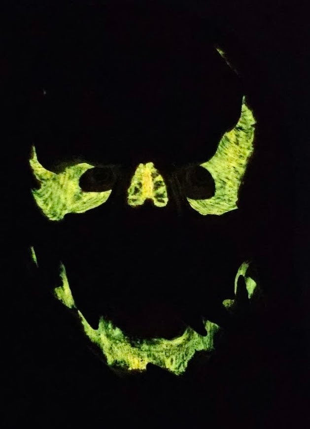 Jack O’ Lantern pumpkin silicone face mask glowing green in the dark