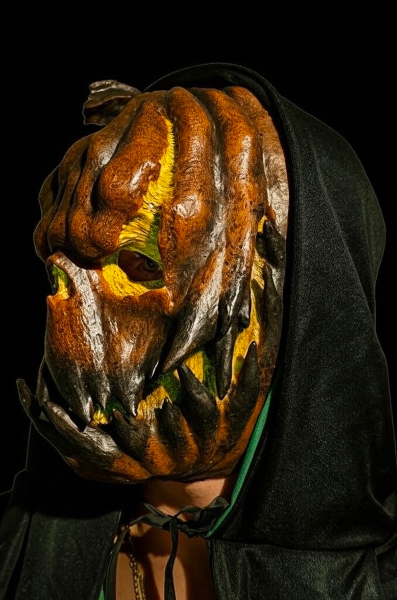 Jack O’ Lantern pumpkin silicone face mask, left-side view